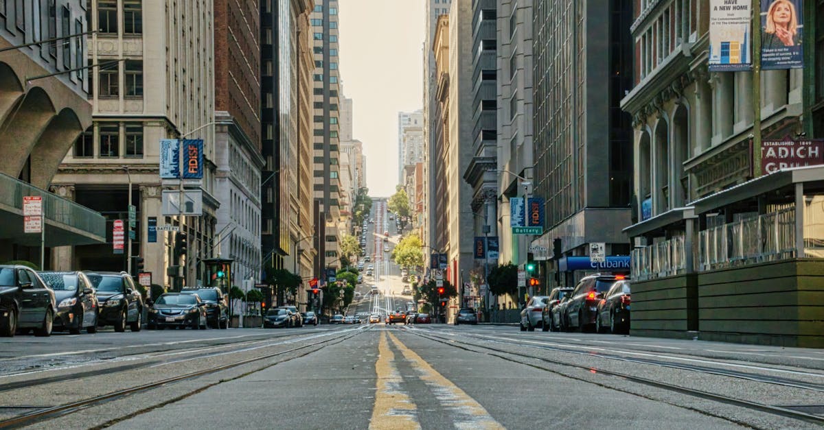 A bustling urban street view showcasing San Francisco's iconic cityscape with busy traffic and tall buildings.