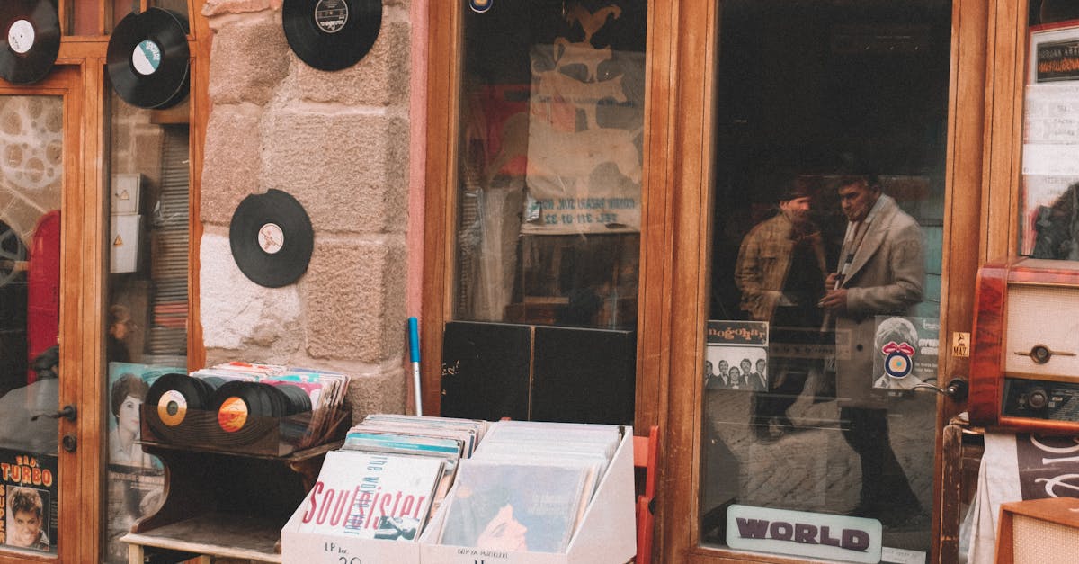 Explore a nostalgic music store entrance displaying classic vinyl records and captivating street reflections.
