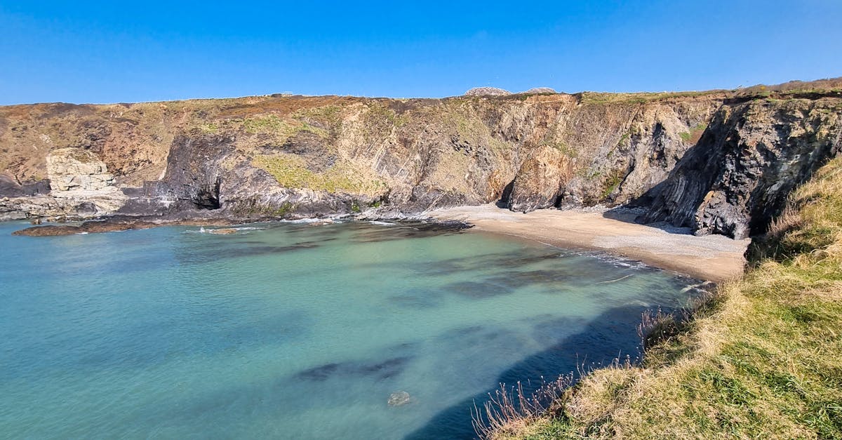 Picturesque beach cove with clear blue waters in St Davids, Wales.