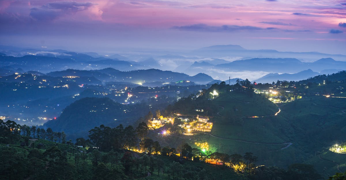 Stunning twilight landscape of illuminated hills in Munnar, Kerala, India.