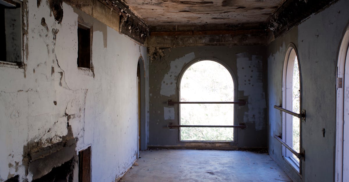 Explore the decaying beauty of this deserted mansion's weathered interior.