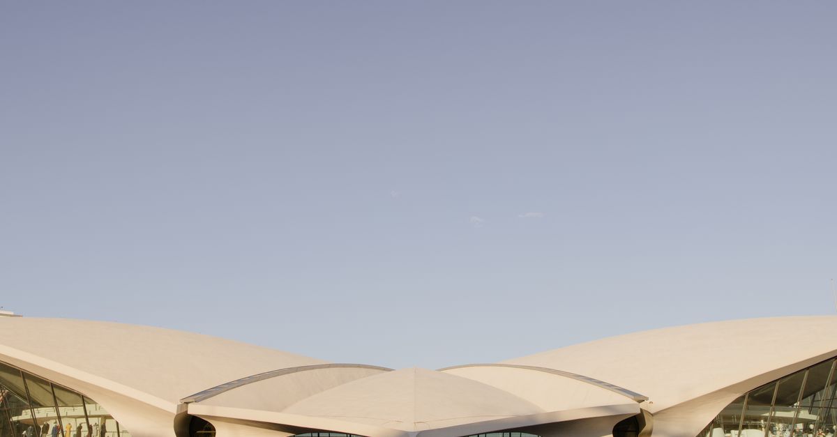 Stunning architectural design of the TWA Flight Center in New York's JFK Airport captured in daylight.