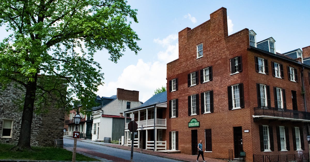 Charming historic street with brick buildings and greenery, perfect for urban exploration.