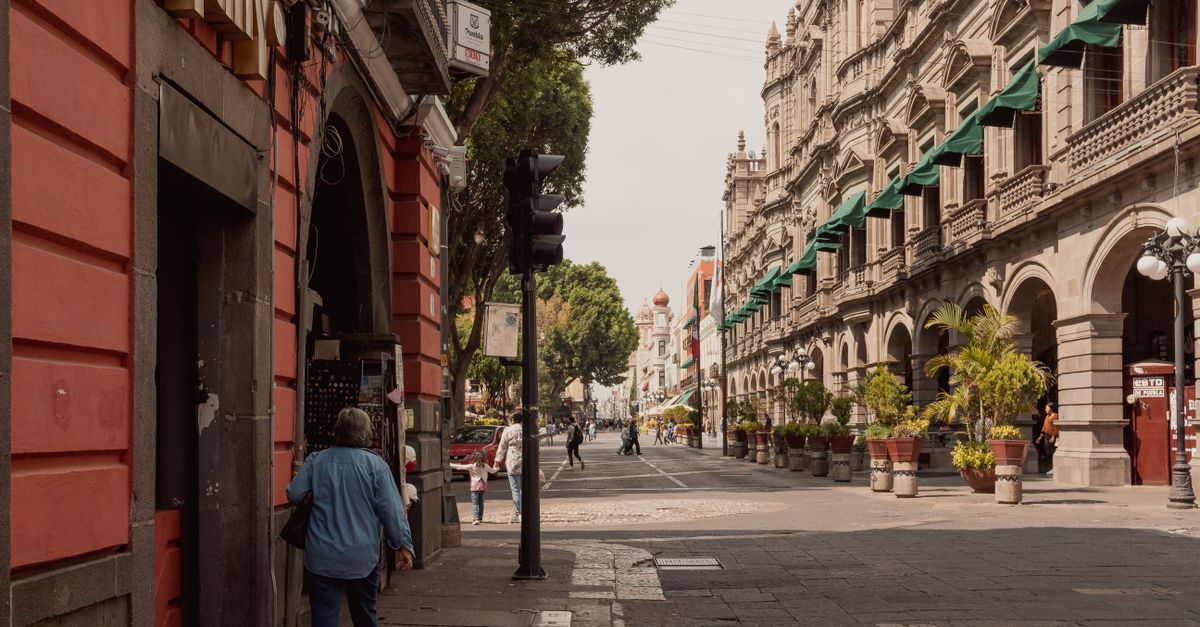 Beautiful street view of Heroica Puebla de Zaragoza with historic architecture and city life.