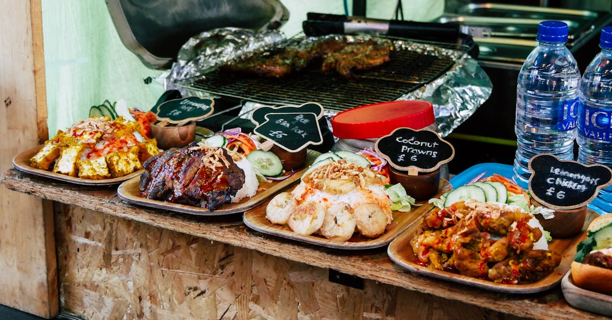 Colorful street food dishes on display at Greenwich Food Market in London, highlighting diverse cuisines.