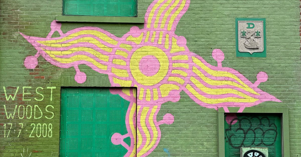 Vibrant street art decorates a wall in Beveren, Belgium, featuring unique graffiti styles.