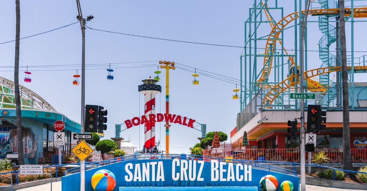 Explore the vibrant entrance of Santa Cruz Beach Boardwalk under the summer sun.