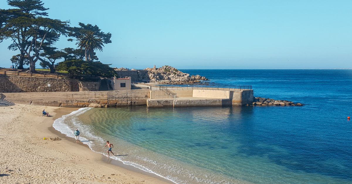 Stunning beach scene at Monterey Peninsula capturing a tranquil, sunny shoreline.
