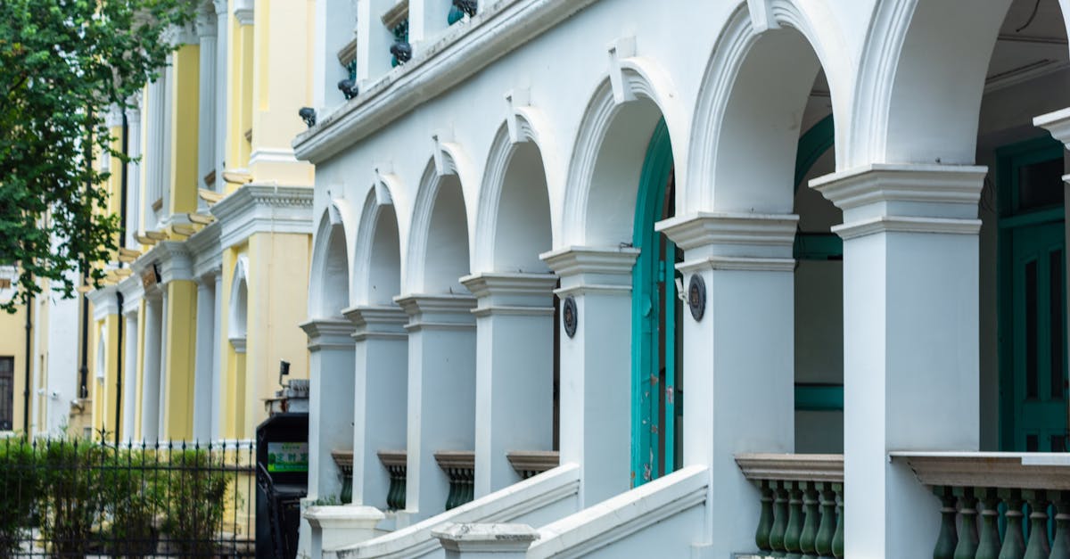 Captivating view of classical colonial buildings with elegant arches and vibrant colors.