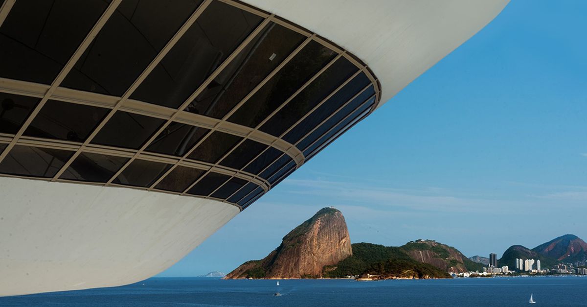 A striking architectural structure against Rio de Janeiro's scenic coastal backdrop.