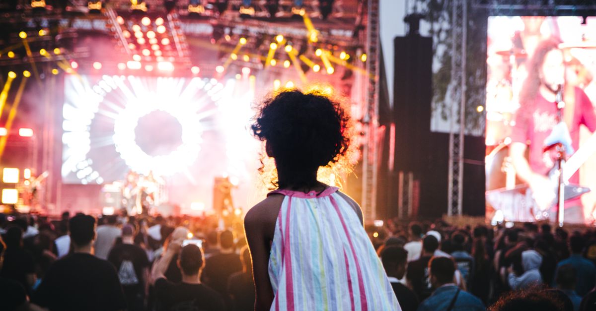 Vibrant outdoor music festival in Casablanca, Morocco with a lively crowd and colorful stage lights.