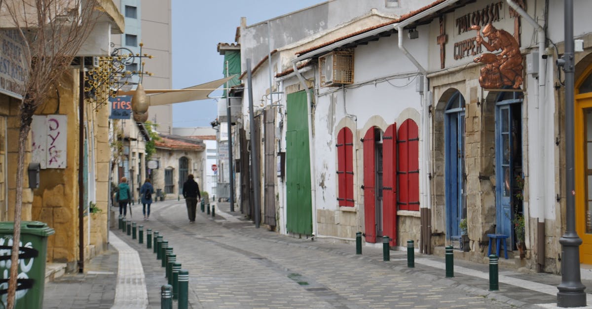 Charming European street with colorful shutters and historic architecture in a quiet neighborhood.