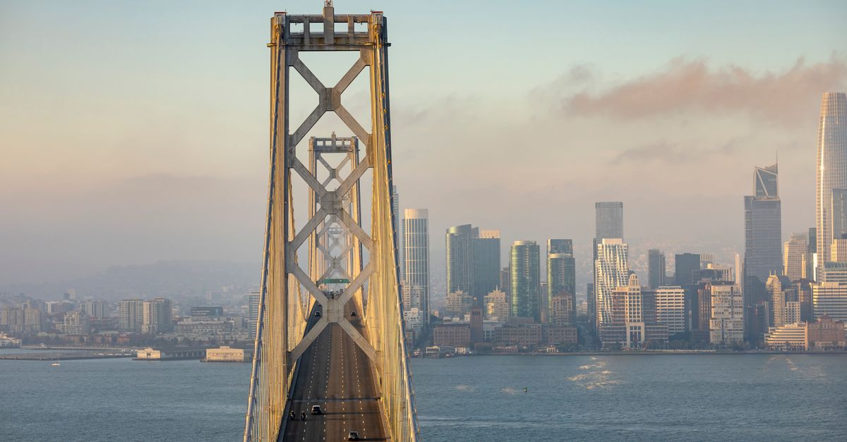 Bay Bridge crossing San Francisco Bay with iconic city skyline in daylight.