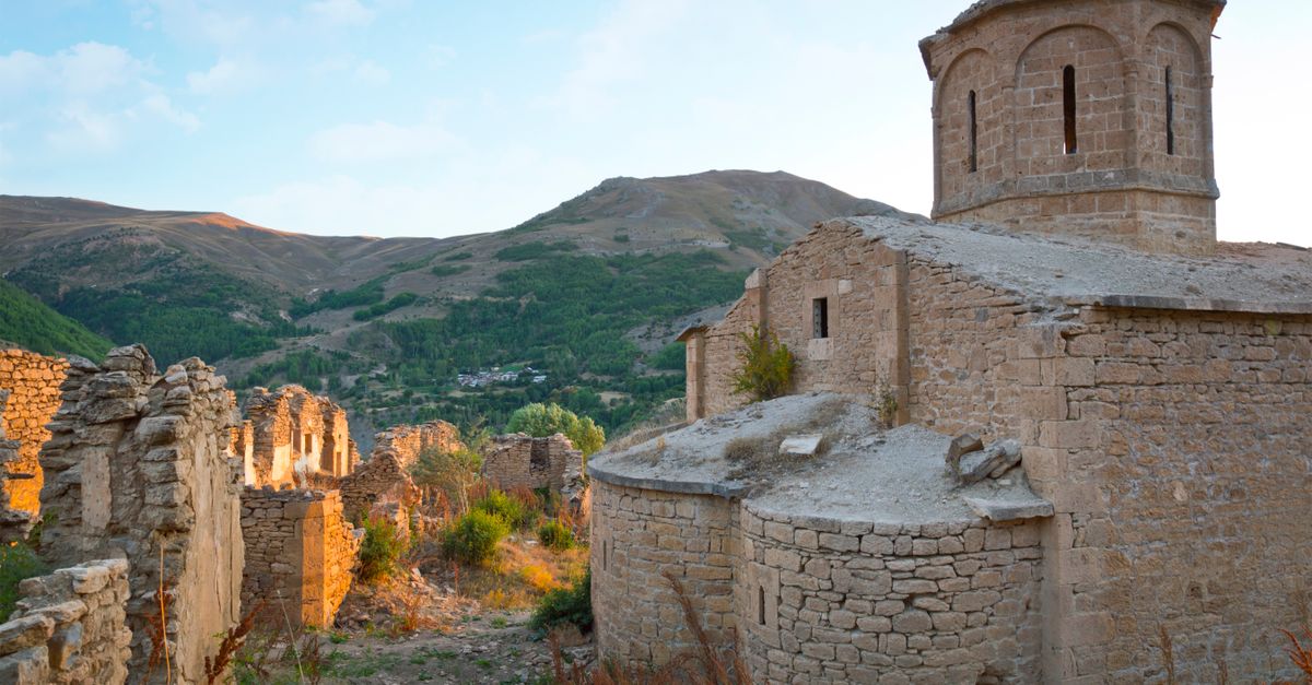 Explore the ancient ruins of Imera Monastery nestled in the mountainous landscape of Turkey.