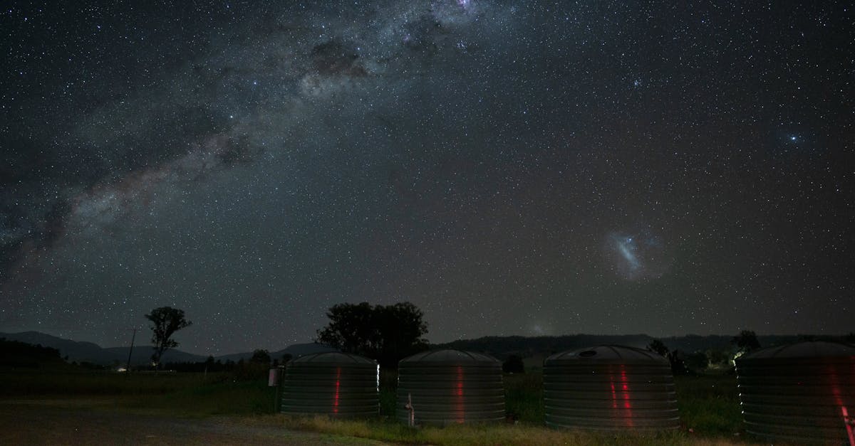 Breathtaking Milky Way view over silos at Christmas Creek, Australia, under a clear night sky.