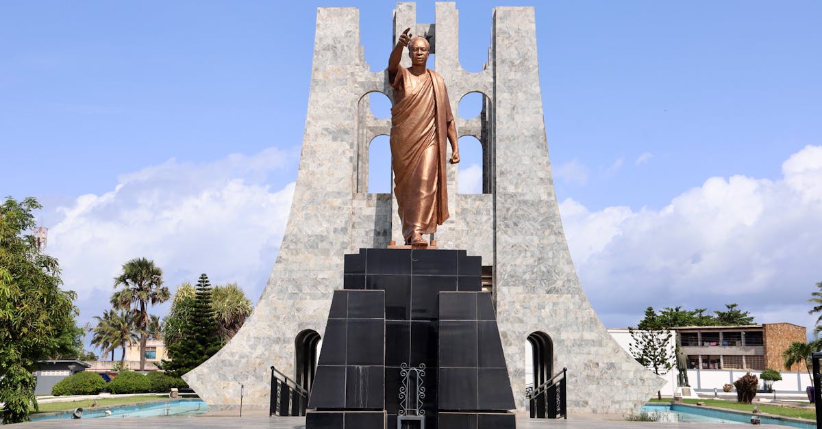 A striking view of the Kwame Nkrumah Mausoleum in Accra, showcasing the bronze statue and marble arch.