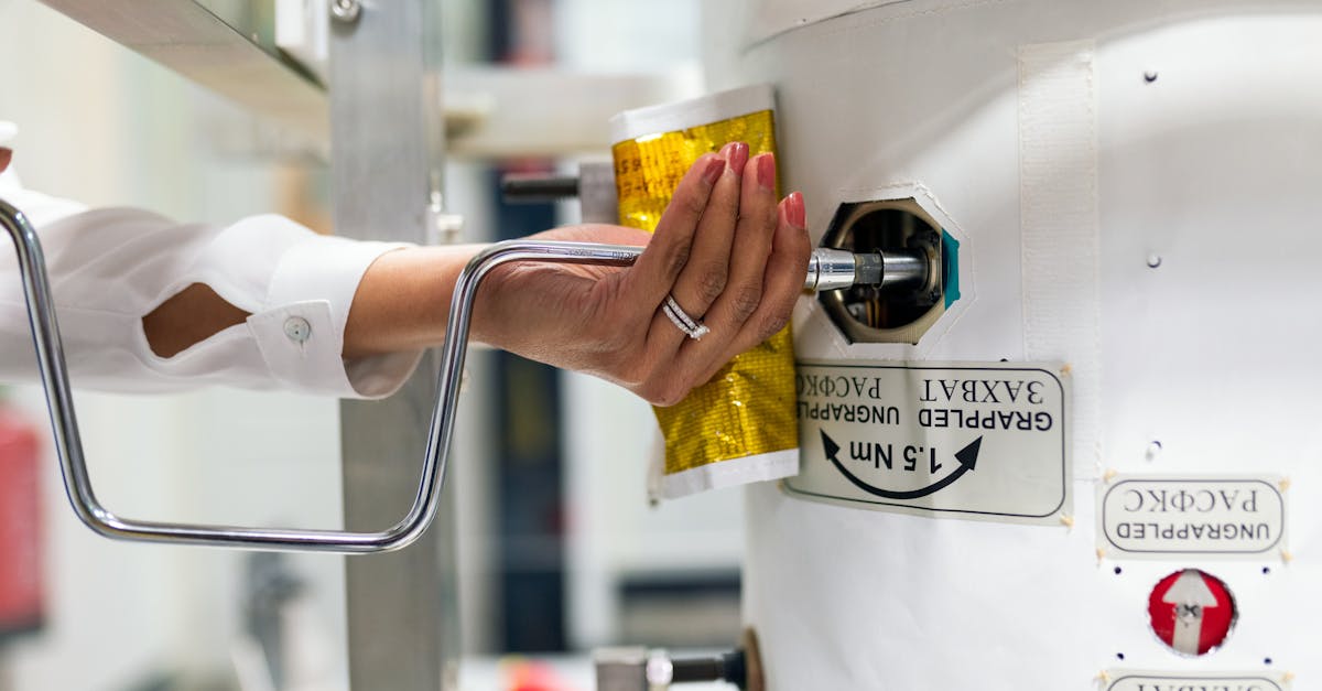 A female scientist adjusts laboratory equipment for a research experiment.