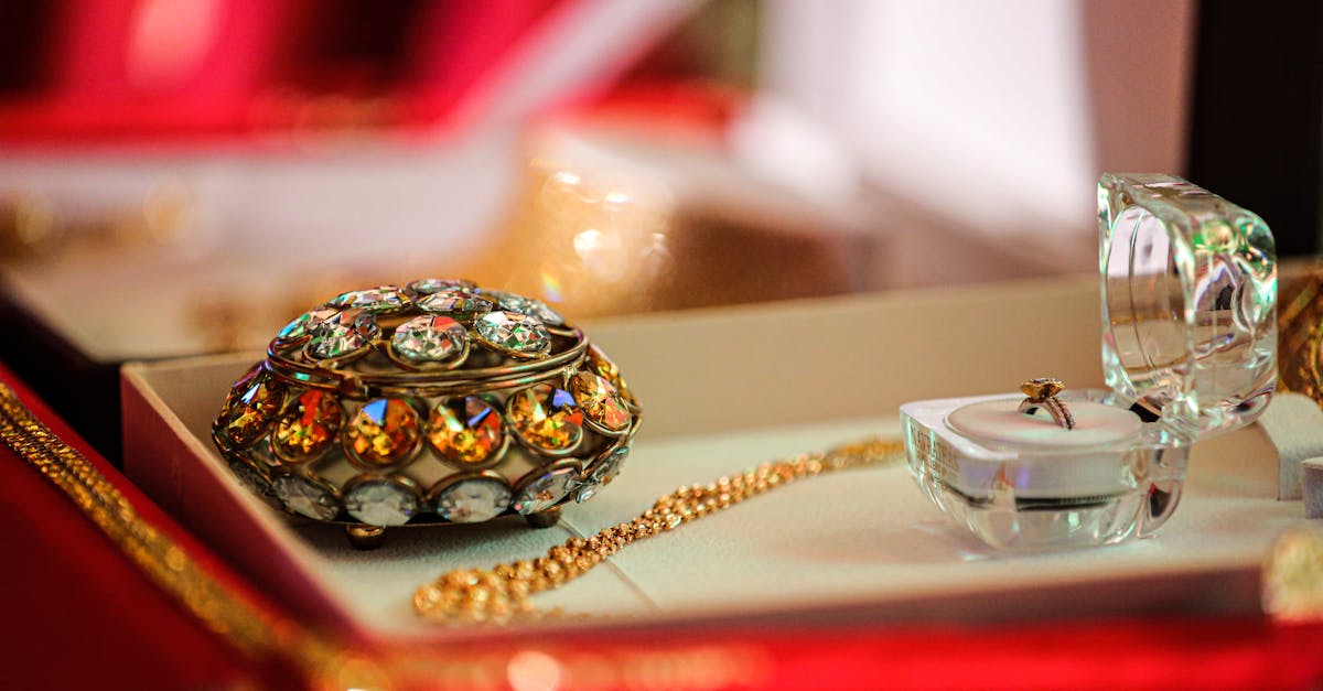 Close-up of a luxurious jewelry box with exquisite gold and jeweled accessories in an elegant display.