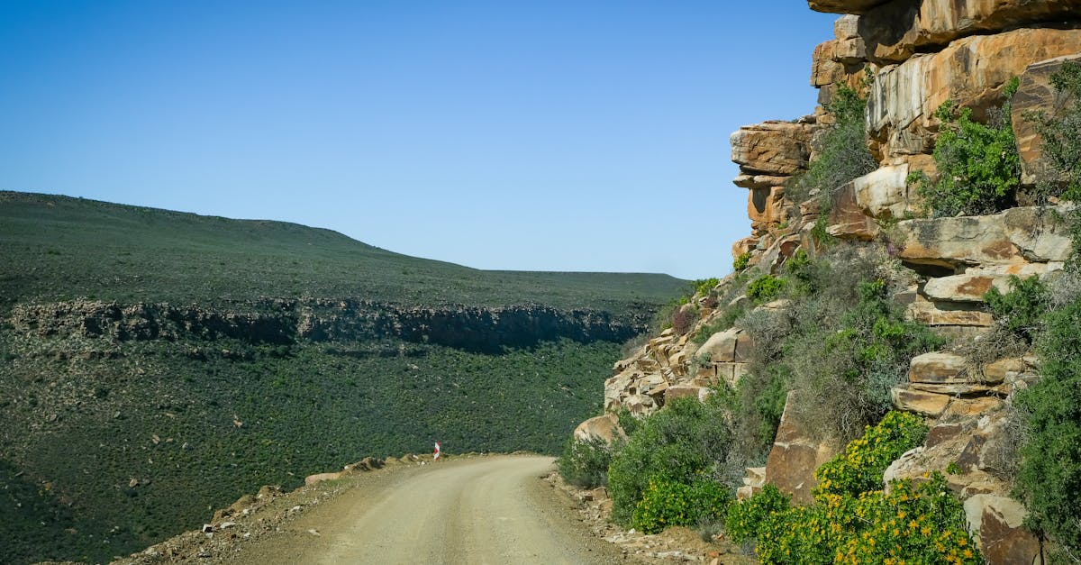A stunning view of a dirt road winding through rocky terrain in Western Cape, South Africa.