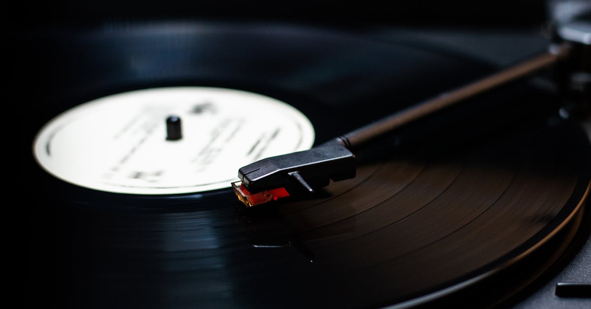Detailed close-up of a classic vinyl record player spinning a vintage record, emphasizing warm sound.