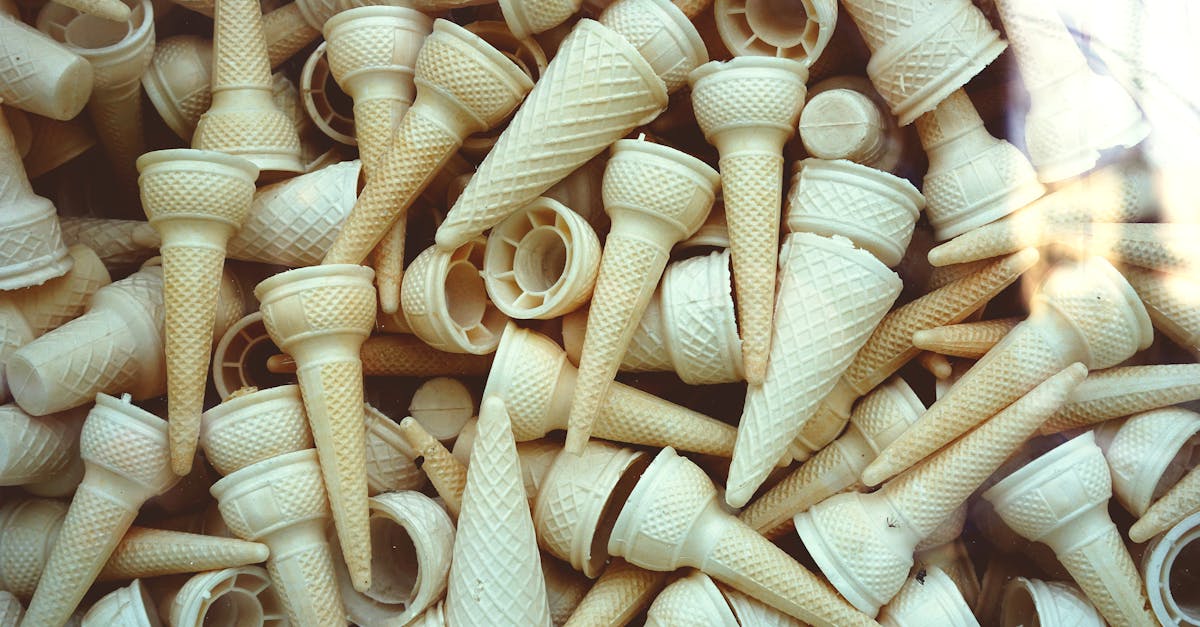 A top-view shot of a pile of empty waffle ice cream cones showcasing texture and variety.