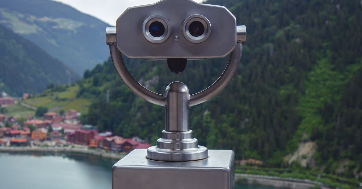 Coin-operated telescope viewing Uzungöl Lake and surrounding mountains in Trabzon, Turkey.