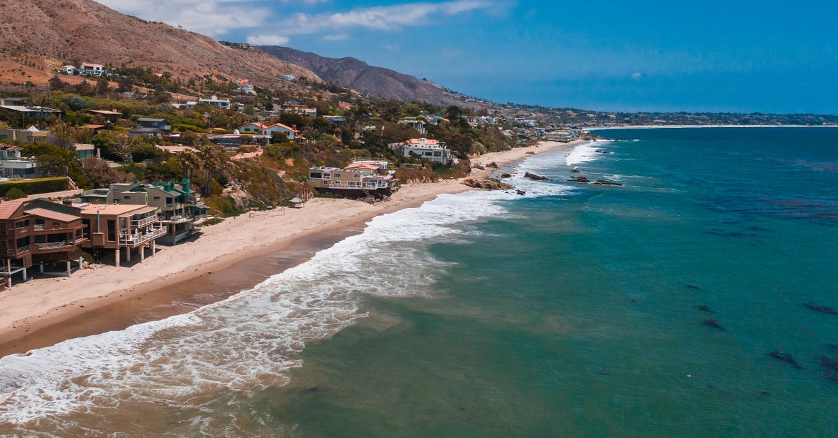 A breathtaking aerial view of Malibu's beachfront homes along the scenic coastline.