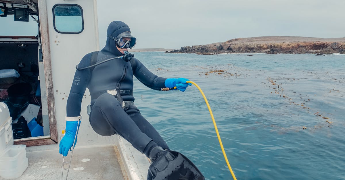 Scuba diver in gear about to explore the ocean from a boat.